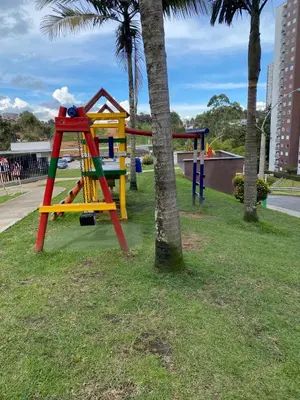a playground with a colorful swing set in a park at Apartamento Resort Rionegro in Rionegro