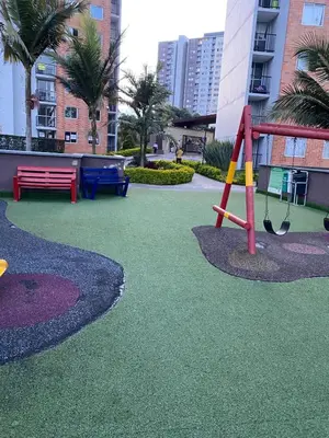 a playground with a swing in a city at Apartamento Resort Rionegro in Rionegro