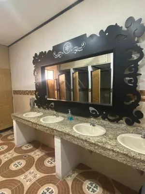 a bathroom with three sinks and a large mirror at Hotel Hollywood Paradise ZF in Rionegro