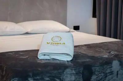 a towel sitting on top of a bed at Hotel Yuma in La Dorada
