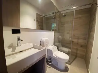 a bathroom with a sink and a toilet and a shower at Hotel Yuma in La Dorada