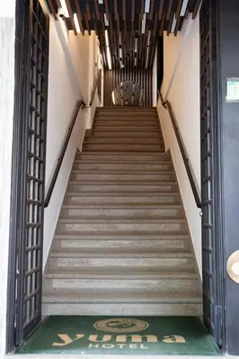 a stairway leading up to a building at Hotel Yuma in La Dorada