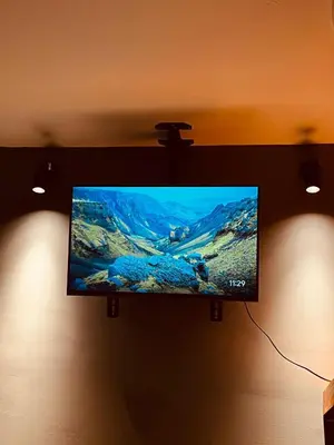 a flat screen tv hanging on a wall at Renacer, Poblado Manila in Medellín