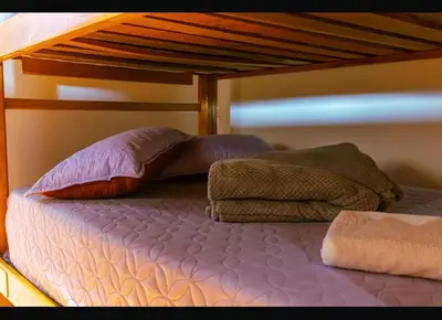 a bunk bed with two pillows on top of it at Suite Master in Jericó