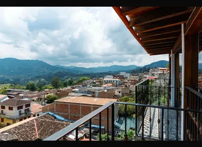 a view of a city from the balcony of a house at Suite Master in Jericó