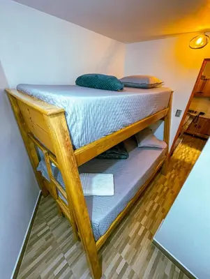 a bunk bed in a room with a bedvisorvisor at Suite Encanto in Jericó