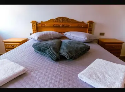two pillows sitting on top of a bed at Suite Encanto in Jericó