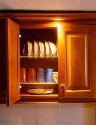 a cabinet with plates and shoes in it at Suite Encanto in Jericó