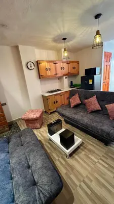 a living room with a couch and a table at Suite Encanto in Jericó