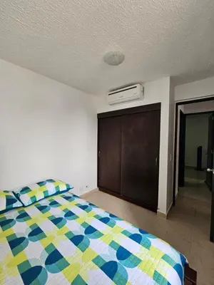 a bedroom with a colorful bed and a closet at Apartasol Ciudadela Santa Fé 