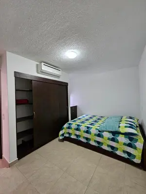 a bedroom with a bed and a closet at Apartasol Ciudadela Santa Fé 