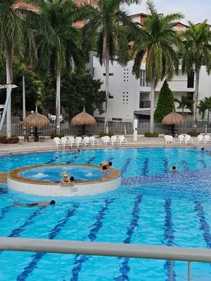a large swimming pool with two dogs in it at Apartasol Ciudadela Santa Fé 