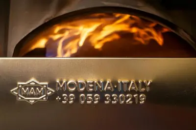 a pizza oven with the name molina italy on it at TERRAKOTA Heritage House in Mariquita