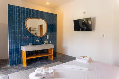 a bathroom with a sink and a mirror at TERRAKOTA Heritage House in Mariquita