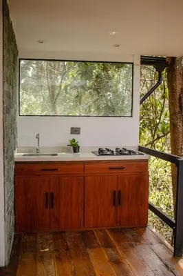 a kitchen with a sink and a window at Cabaña Aventurina- La pascana Ecolodge Entorno natural excepcional, conexión con la naturaleza y avistamiento de aves, Ubicado a 3km del metrocable y Parque Arvi, Guarne in Mazo