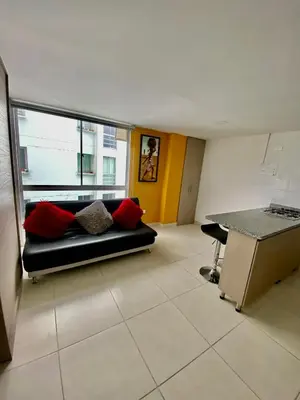 a living room with a couch and a table at Apartamento , frente a la universidad autónoma , edificio urban in Manizales