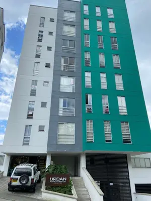 a building with a car parked in front of it at Apartamento , frente a la universidad autónoma , edificio urban in Manizales