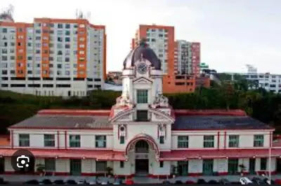 a building with a clock tower on top of it at Apartamento , frente a la universidad autónoma , edificio urban in Manizales