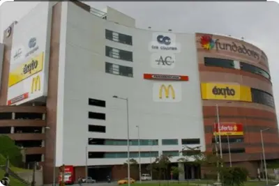 a large building with alot of signs on it at Apartamento , frente a la universidad autónoma , edificio urban in Manizales