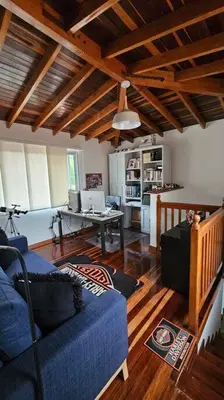 a living room with a blue couch and a table at Casa campestre,Guarne-Aeropuerto in Guarne