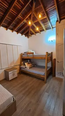 a bedroom with two bunk beds in a room at Casa campestre,Guarne-Aeropuerto in Guarne