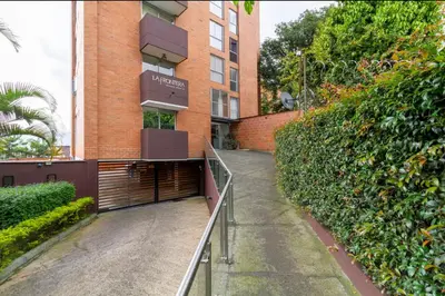 a building with a gate in front of a building at Aparta loft in Envigado