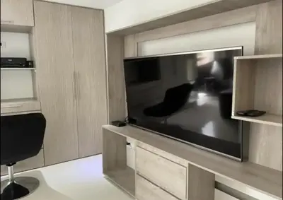 a living room with a large flat screen tv at Aparta loft in Envigado