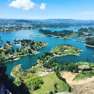 an aerial view of a group of islands in a river at Babakan in Guatapé