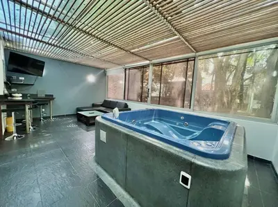 a large bathroom with a large blue tub in a room at Private Jacuzzi 3 Bedroom apartment in Provenza cartagena in Medellín