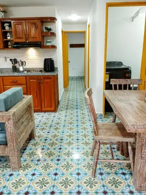 a kitchen with a table and chairs in a room at Jericó un pueblo de ensueño in Jericó