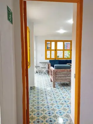 a hallway with a living room with a couch at Jericó un pueblo de ensueño in Jericó