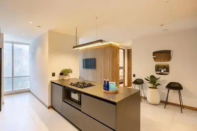 a kitchen with a stove and a counter top at Bio 26 Apartments in Medellín