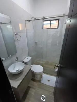 a bathroom with a toilet and a sink and a shower at Hotel Internacional Boutique Milan in Puerto Boyacá