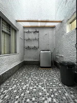 a room with a room with ailed floor and a room with at Hogar El Descanso Itagui in Itagüí