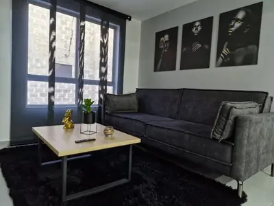 a living room with a couch and a coffee table at Modernos apartamentos cerca al Poblado in Medellín