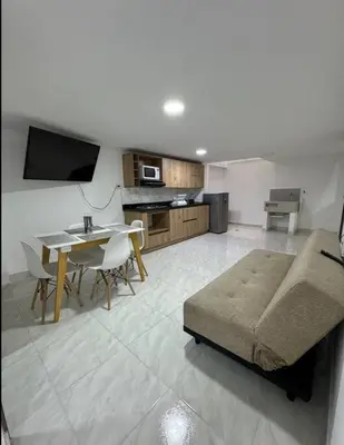 a living room with a couch and a table at Alojamiento en Sonsón in Sonsón