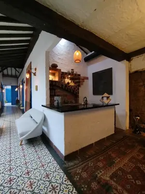 a kitchen with a sink and a tv on a wall at Patio Chic in Jericó