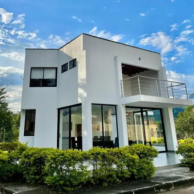 a white house with a balcony on it at Casa Lili in Sopetran