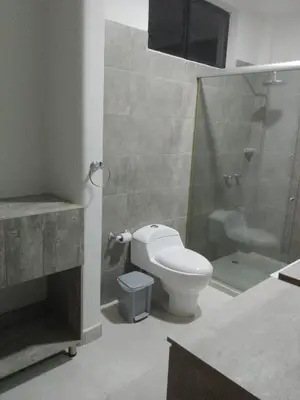 a bathroom with a toilet and a glass shower at Casa Lili in Sopetran