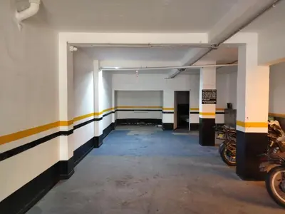 an empty parking garage with motorcycles parked in it at Hotel Medellin Park in Medellín