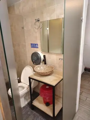 a bathroom with a sink and a toilet at Hotel Medellin Park in Medellín
