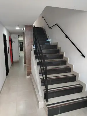 a staircase in a building with black and white steps at Hotel Medellin Park in Medellín