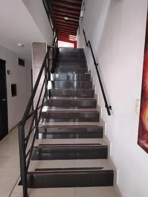 a staircase in a building with black and gray steps at Hotel Medellin Park in Medellín