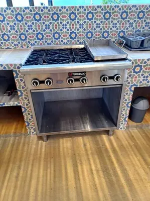 a stove top oven sitting in a kitchen at Vista preciosa-clima cálido-calma-pueblo histórico in Santa Fe de Antioquia