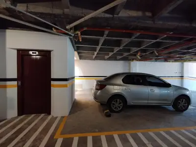 a silver car parked in a parking garage at Apartamento nuevo en primer piso in Jardin