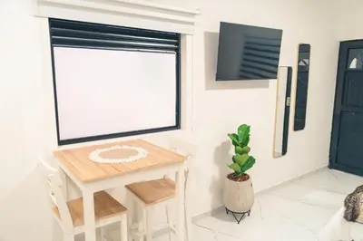 a room with a table and a window at Apto 203 - Casa bendita in Medellín