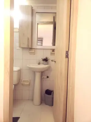 a small bathroom with a sink and a toilet at Divino Apartamento Moderno con la Mejor Ubicación in Manizales