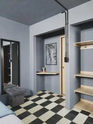 a bedroom with a black and white checkered floor at Spacious dream house Medellín Laureles in Medellín