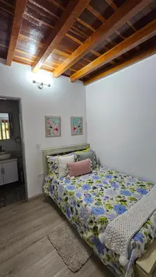 a bedroom with a bed in a room at Casa campestre, Guarne-Aeropuerto José María Córdova in Guarne