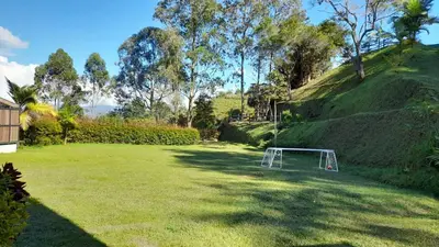 a lawn with a soccer goal in the middle at Acogedora Casa De Campo Con Jakuzzi, Descanso Garantizado in El Peñol